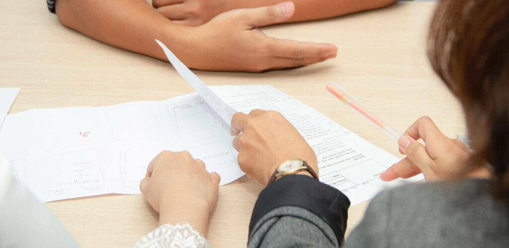 People reviewing a document