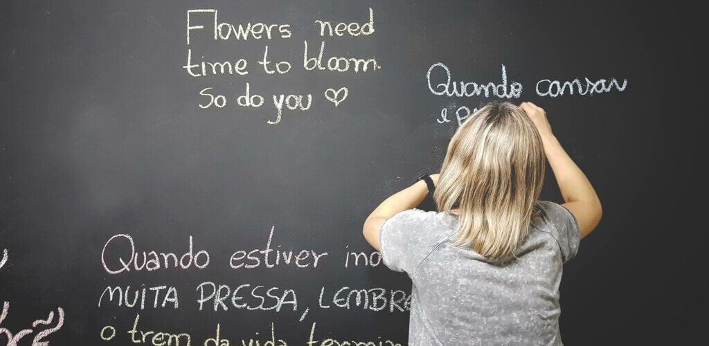 Translator writing on whiteboard